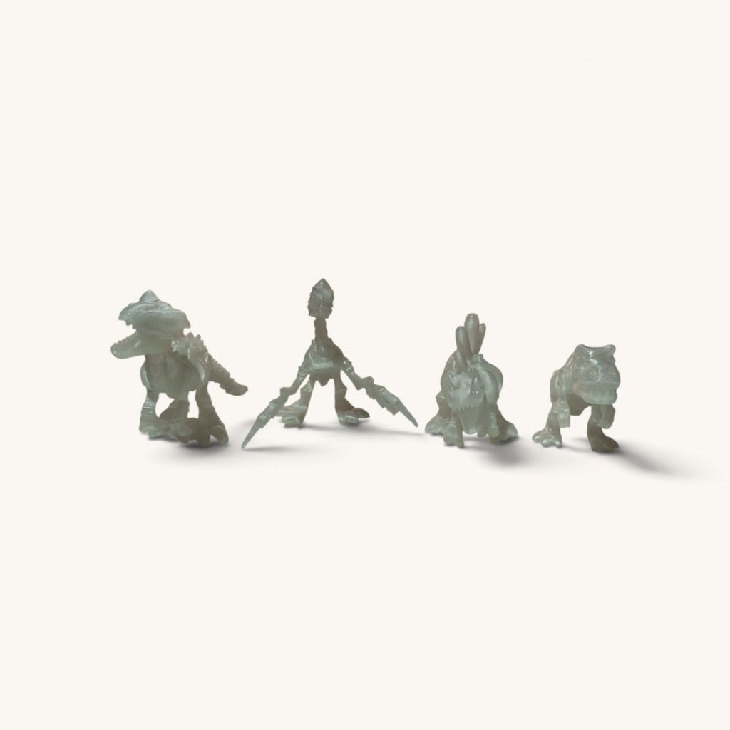 Os quatro modelos lado a lado: T-Rex, Pteranodonte, Espinossauro e Velociraptor